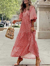 Vestido largo informal con cuello joya, mangas 3/4 y estampado floral